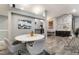 Stylish dining space showcasing an art piece and seamless flow to other living areas at 3099 Palmdesert Way, Las Vegas, NV 89120