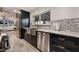 Chic kitchen featuring stainless steel appliances, sleek countertops, and dark cabinetry at 3099 Palmdesert Way, Las Vegas, NV 89120