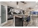 Updated kitchen with stainless appliances, island, and access to the living area at 3099 Palmdesert Way, Las Vegas, NV 89120