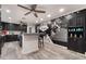Well-appointed kitchen offering a breakfast bar, mural, and modern appliances at 3099 Palmdesert Way, Las Vegas, NV 89120