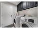 Laundry room featuring Samsung washer and dryer plus storage cabinets at 3099 Palmdesert Way, Las Vegas, NV 89120