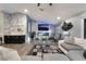 Inviting living room featuring a modern fireplace, stylish bar, and comfortable seating at 3099 Palmdesert Way, Las Vegas, NV 89120