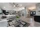 Open-concept living room featuring modern decor, stylish furniture, and seamless flow to kitchen at 3099 Palmdesert Way, Las Vegas, NV 89120