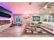 Comfortable living room with a modern fireplace, stylish decor, and view of the backyard at 3099 Palmdesert Way, Las Vegas, NV 89120