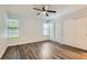 Bright bedroom featuring modern laminate wood flooring, neutral paint, and ample closet space at 318 Heather Dr, Henderson, NV 89002