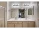 Bathroom featuring a double vanity sink, white cabinets, and enclosed shower at 3400 Cabana Dr # 1068, Las Vegas, NV 89122