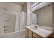 Bathroom featuring a tub with shower and a sink with a large mirror at 3400 Cabana Dr # 1068, Las Vegas, NV 89122