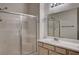 Bathroom featuring a shower with glass doors and vanity sink with white countertop at 3400 Cabana Dr # 1068, Las Vegas, NV 89122