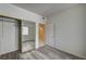 This bedroom features a closet with mirrored doors and wood-look floors at 3400 Cabana Dr # 1068, Las Vegas, NV 89122