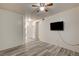 This bedroom features modern wood-look floors and a wall-mounted television at 3400 Cabana Dr # 1068, Las Vegas, NV 89122
