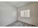 This bedroom has a window and wood-look floors at 3400 Cabana Dr # 1068, Las Vegas, NV 89122