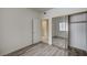 This bedroom features wood-look floors and a closet with mirrored doors at 3400 Cabana Dr # 1068, Las Vegas, NV 89122