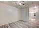 A bedroom with wood floors leading into the attached bathroom at 3400 Cabana Dr # 1068, Las Vegas, NV 89122