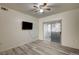 Bedroom featuring hardwood floors, a ceiling fan, and a sliding glass door leading to a balcony at 3400 Cabana Dr # 1068, Las Vegas, NV 89122