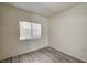 Bedroom featuring wood flooring and natural light from a window at 3400 Cabana Dr # 1068, Las Vegas, NV 89122