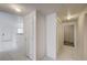 This hallway has white tile flooring and leads to a storage closet at 3400 Cabana Dr # 1068, Las Vegas, NV 89122