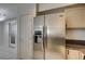 The kitchen features a stainless steel refrigerator with marble countertops at 3400 Cabana Dr # 1068, Las Vegas, NV 89122