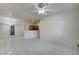 Open-concept living room adjacent to kitchen with bright, natural light at 3400 Cabana Dr # 1068, Las Vegas, NV 89122