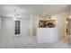 Bright living room with adjacent kitchen and ample natural light from doors at 3400 Cabana Dr # 1068, Las Vegas, NV 89122