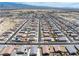 Wide angle view of a community showcasing uniform housing design in the desert landscape against distant mountains at 3543 E Malheur Ave, Pahrump, NV 89061