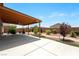 Large backyard patio, complete with a covered seating area and manicured landscaping at 3543 E Malheur Ave, Pahrump, NV 89061
