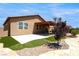 Lovely backyard patio, green lawn, and stone design offers a private, relaxing retreat at 3543 E Malheur Ave, Pahrump, NV 89061