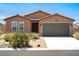 Charming single-story house with a well-maintained front yard and a two-car garage at 3543 E Malheur Ave, Pahrump, NV 89061