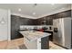 Well-equipped kitchen boasting stainless steel appliances, granite counters, and a center island at 3543 E Malheur Ave, Pahrump, NV 89061