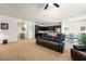 Expansive living room with views of the kitchen and dining area, featuring a comfortable recliner sofa at 3543 E Malheur Ave, Pahrump, NV 89061