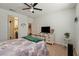 Bright bedroom with a ceiling fan, TV, large window, and soft carpeting at 3543 E Malheur Ave, Pahrump, NV 89061