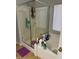 Shower featuring sleek glass doors, tile, and modern fixtures at 3928 Ropers Ranch St, North Las Vegas, NV 89032
