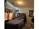 Bedroom featuring a wooden bed frame and a large window at 3928 Ropers Ranch St, North Las Vegas, NV 89032