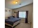 Cozy bedroom with a comfortable bed and natural light from the window at 3928 Ropers Ranch St, North Las Vegas, NV 89032