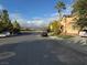 Street view of homes with green lawns and mountain views in the distance at 3928 Ropers Ranch St, North Las Vegas, NV 89032