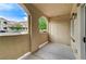 Balcony with block style wall and door to storage and with neighborhood view at 3930 Legend Hills St # 102, Las Vegas, NV 89129