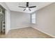 Bedroom featuring a ceiling fan, tile floors, and a closet with built-in shelving at 3930 Legend Hills St # 102, Las Vegas, NV 89129