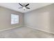 Bright bedroom features a ceiling fan and a window allowing for ample natural light at 3930 Legend Hills St # 102, Las Vegas, NV 89129