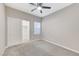 Cozy bedroom with ceiling fan, window, carpet, and closet at 3930 Legend Hills St # 102, Las Vegas, NV 89129