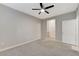 This bedroom has neutral walls, a ceiling fan, and provides entry to another room at 3930 Legend Hills St # 102, Las Vegas, NV 89129