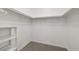 Walk-in closet features carpeted floors and shelving with ample storage space at 3930 Legend Hills St # 102, Las Vegas, NV 89129