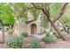 Charming home with well-maintained landscaping, mature trees, and a welcoming front entrance at 3930 Legend Hills St # 102, Las Vegas, NV 89129