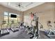 Community gym with modern fitness equipment and a window providing natural light at 3930 Legend Hills St # 102, Las Vegas, NV 89129