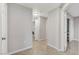 Hallway with tile floors, multiple closets, and access to a laundry room at 3930 Legend Hills St # 102, Las Vegas, NV 89129