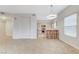 Open-concept layout showcasing the living room, dining area, and kitchen with neutral finishes at 3930 Legend Hills St # 102, Las Vegas, NV 89129