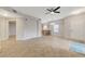 Open-concept living area featuring tile flooring, neutral walls, and a seamless flow into the kitchen at 3930 Legend Hills St # 102, Las Vegas, NV 89129