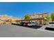 View of the parking lot showing covered parking for residents and visitor parking spots at 3930 Legend Hills St # 102, Las Vegas, NV 89129
