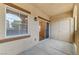 Covered patio features a storage closet, sliding door, and window with a view of the exterior at 3930 Legend Hills St # 102, Las Vegas, NV 89129