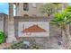 Monument signage for a neighborhood with beautiful plants and a mountain in the background at 3930 Legend Hills St # 102, Las Vegas, NV 89129