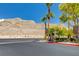 Street view of the community showing cross street intersection with mountain views at 3930 Legend Hills St # 102, Las Vegas, NV 89129