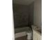 Bathroom features a tiled shower over the tub and modern fixtures at 4300 N Lamont St # 249, Las Vegas, NV 89115